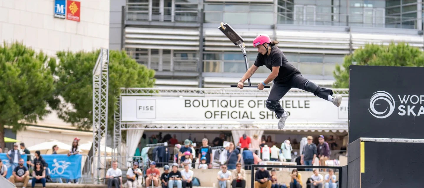 Mia Catalano at milan riding a ethic scooter